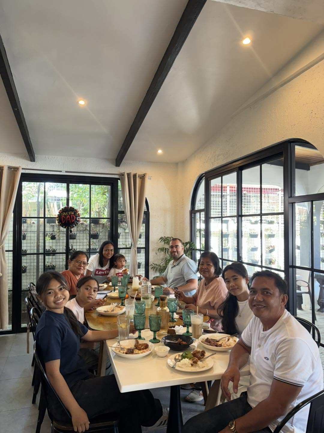 A large group sharing a meal in the restaurant dining room